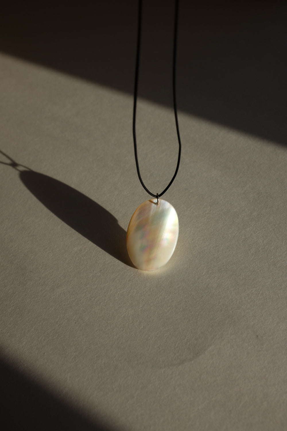 LONG LEATHER MOTHER OF PEARL NECKLACE