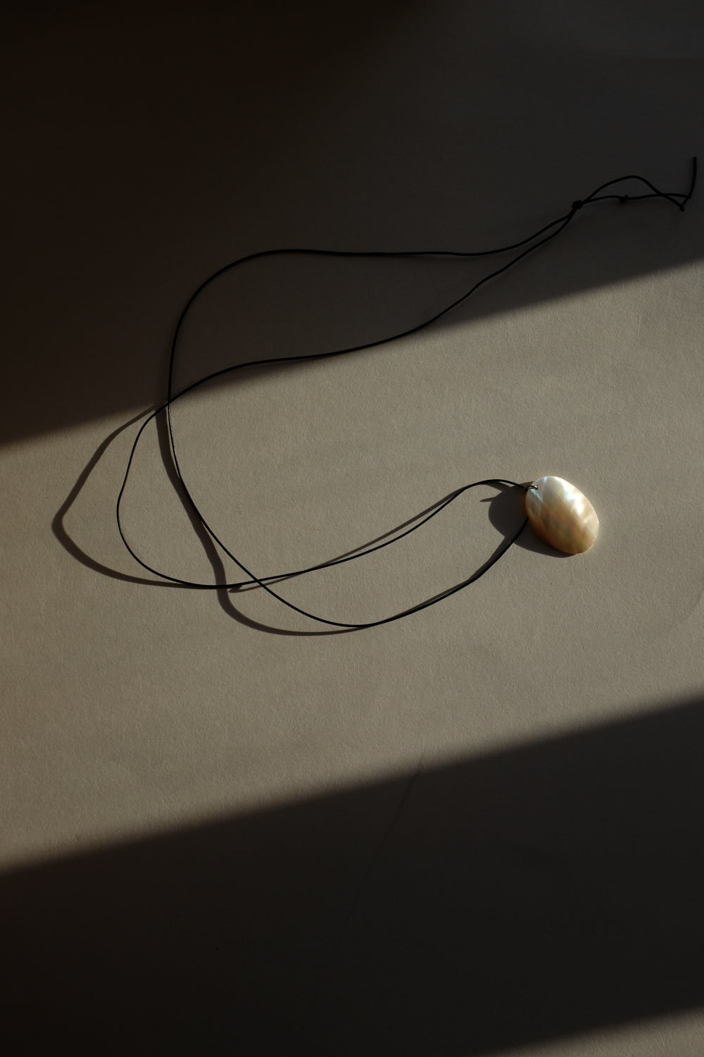 LONG LEATHER MOTHER OF PEARL NECKLACE