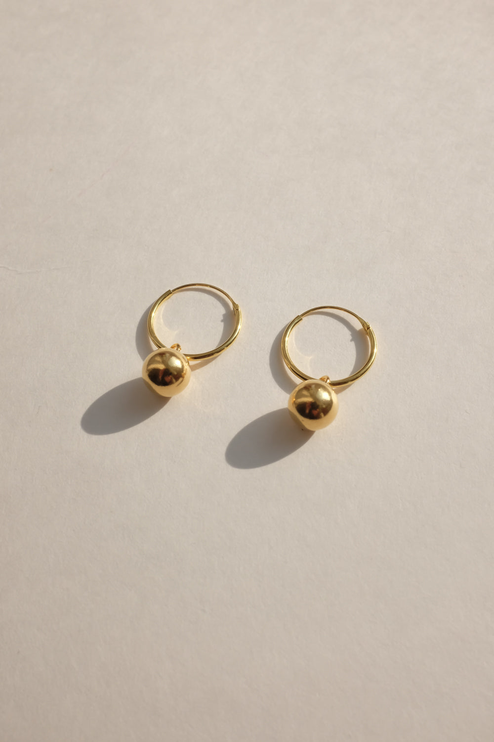 SMALL GOLD PLATED BALL HOOP EARRINGS