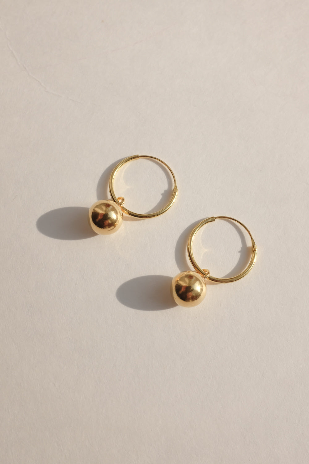 SMALL GOLD PLATED BALL HOOP EARRINGS